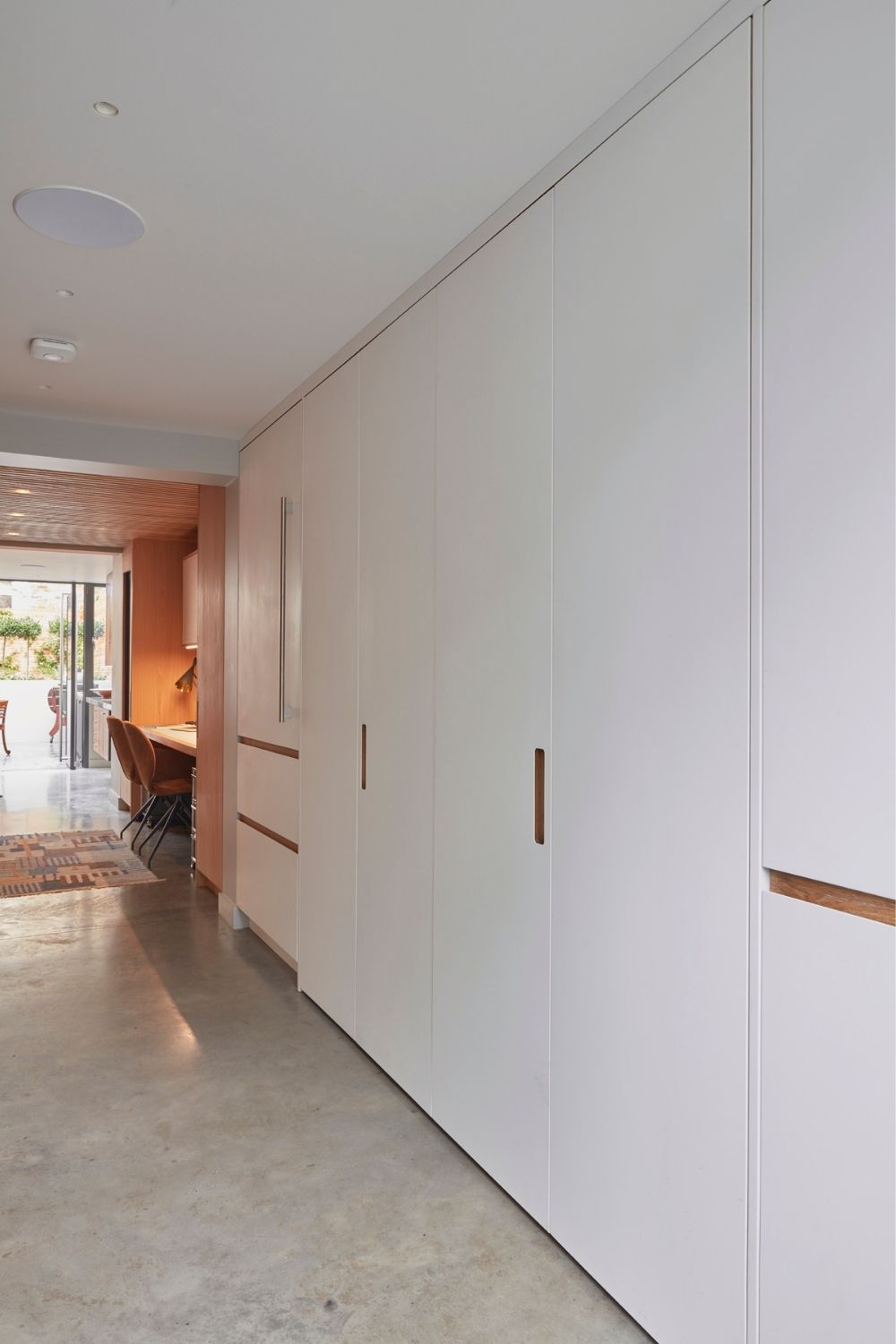 evoke projects ltd islington bespoke hidden kitchen behind full height doors