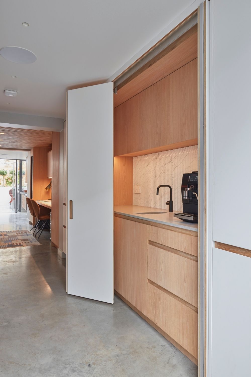 evoke projects ltd islington bespoke hidden kitchen behind full height doors