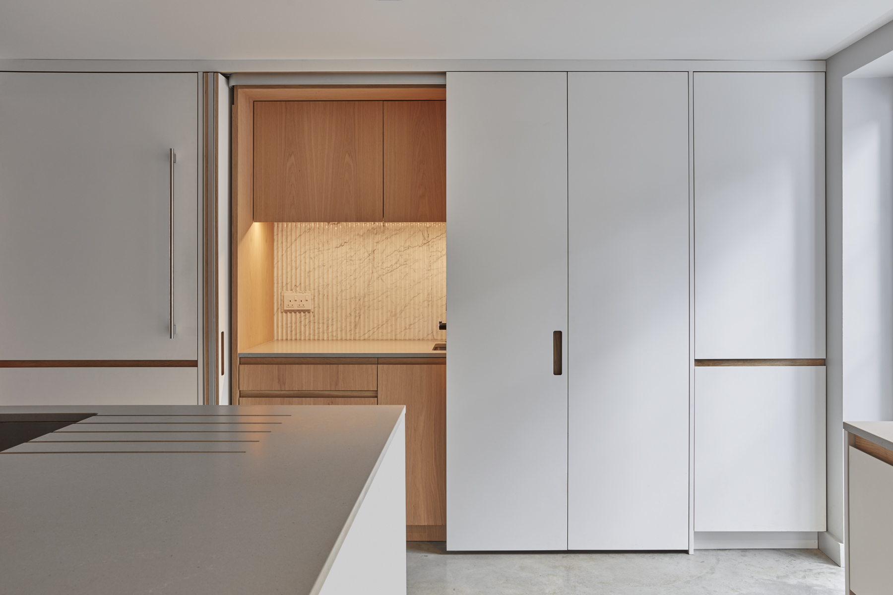 Evoke Projects Ltd Bespoke Kitchen hidden behind folding doors