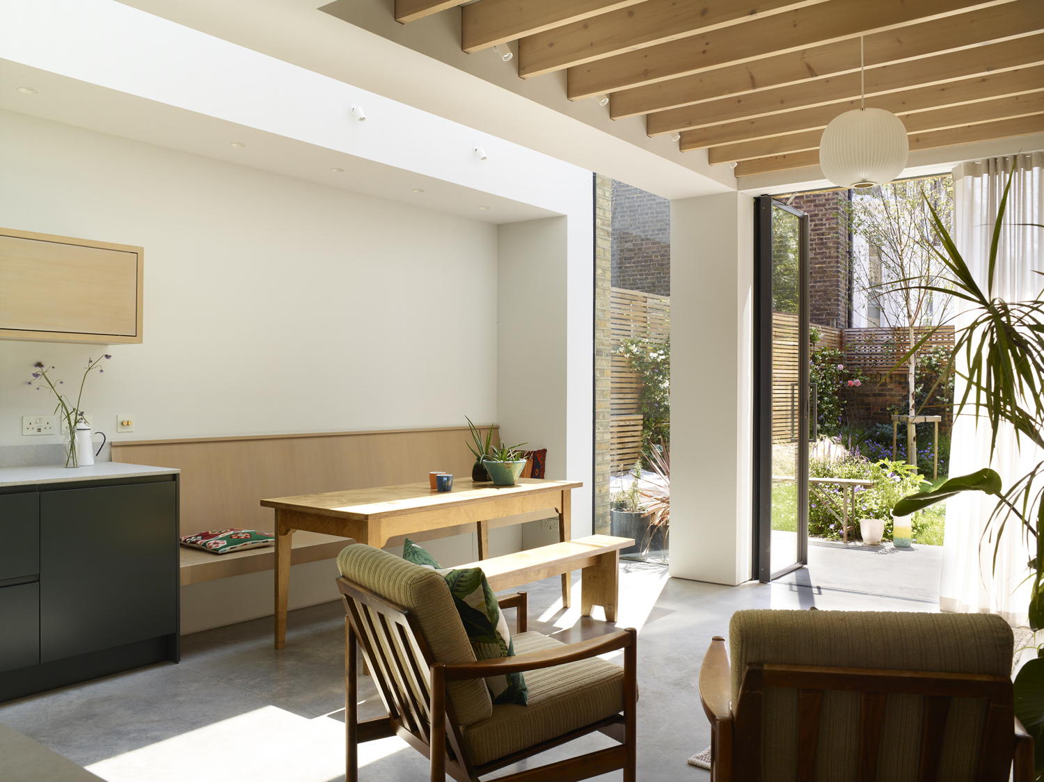 evoke projects ltd bespoke extension and custom kitchen, custom bench exposed rafters