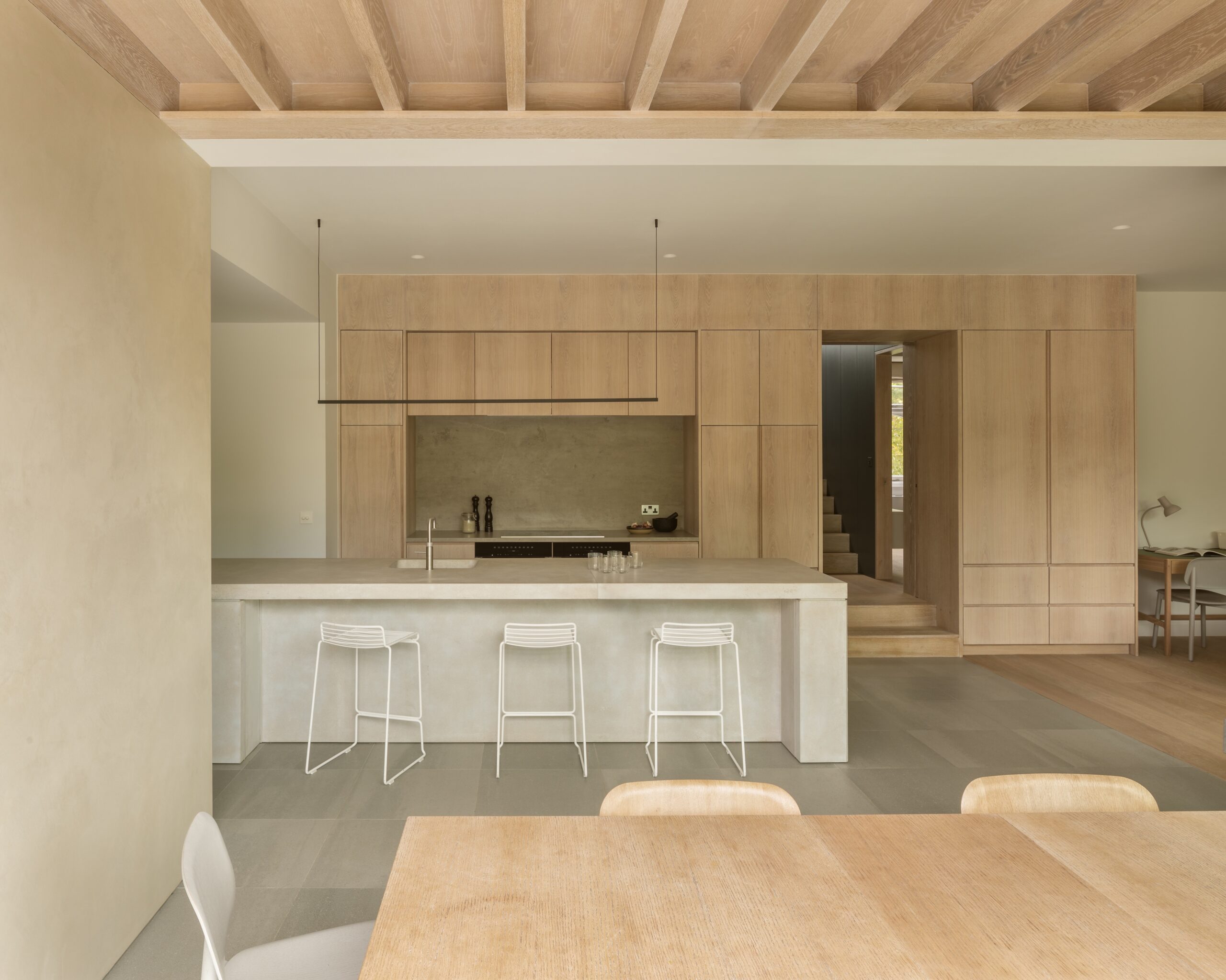 Kitchen with Island Timber cabinets concrete work surfaces