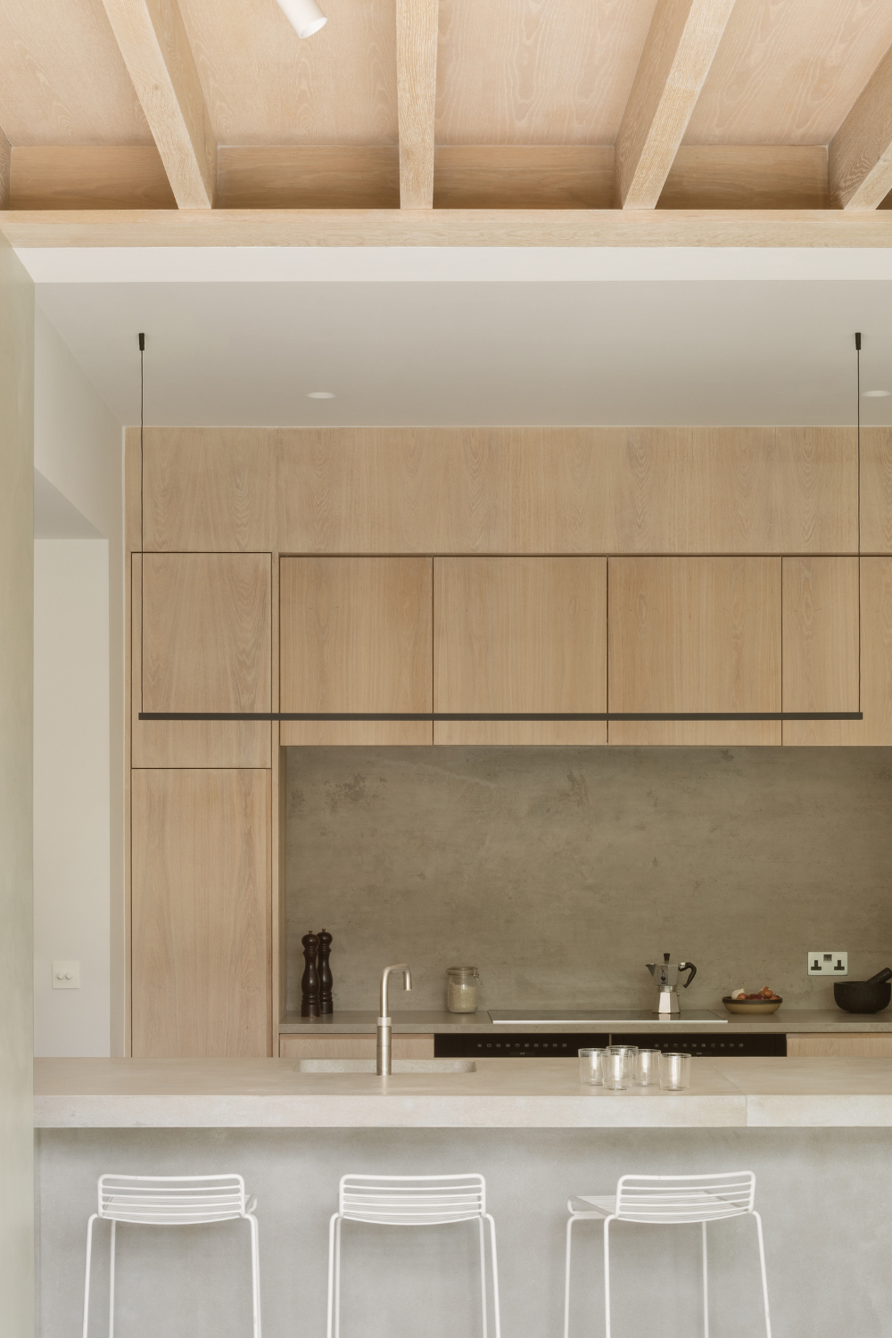 Kitchen shown island with 3 stools and bespoke timber cabinets