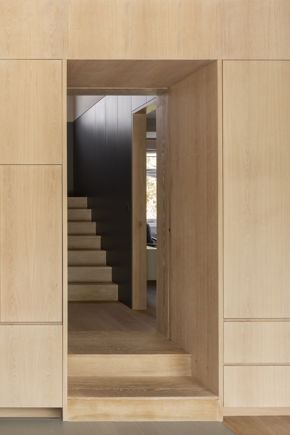 Bespoke timber storage surround doorway from hallway into kitchen